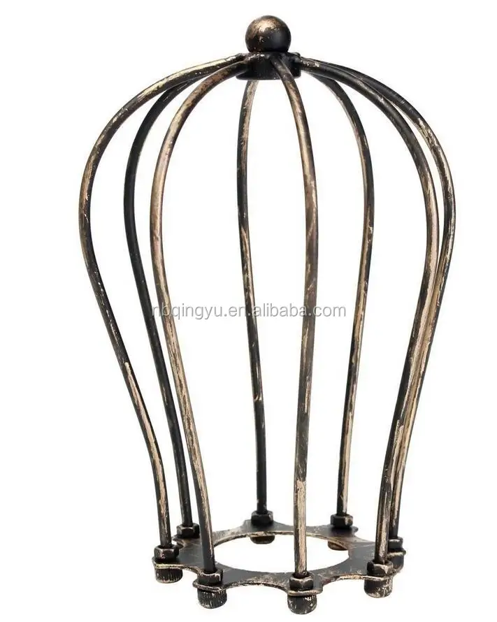 Industrial style metal cage beside lamp cast iron lampshade