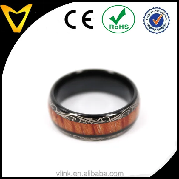 Koa wood inlay black tungsten wedding ring with floral logo lasered on edges koa wood inlay tungsten carbide ring