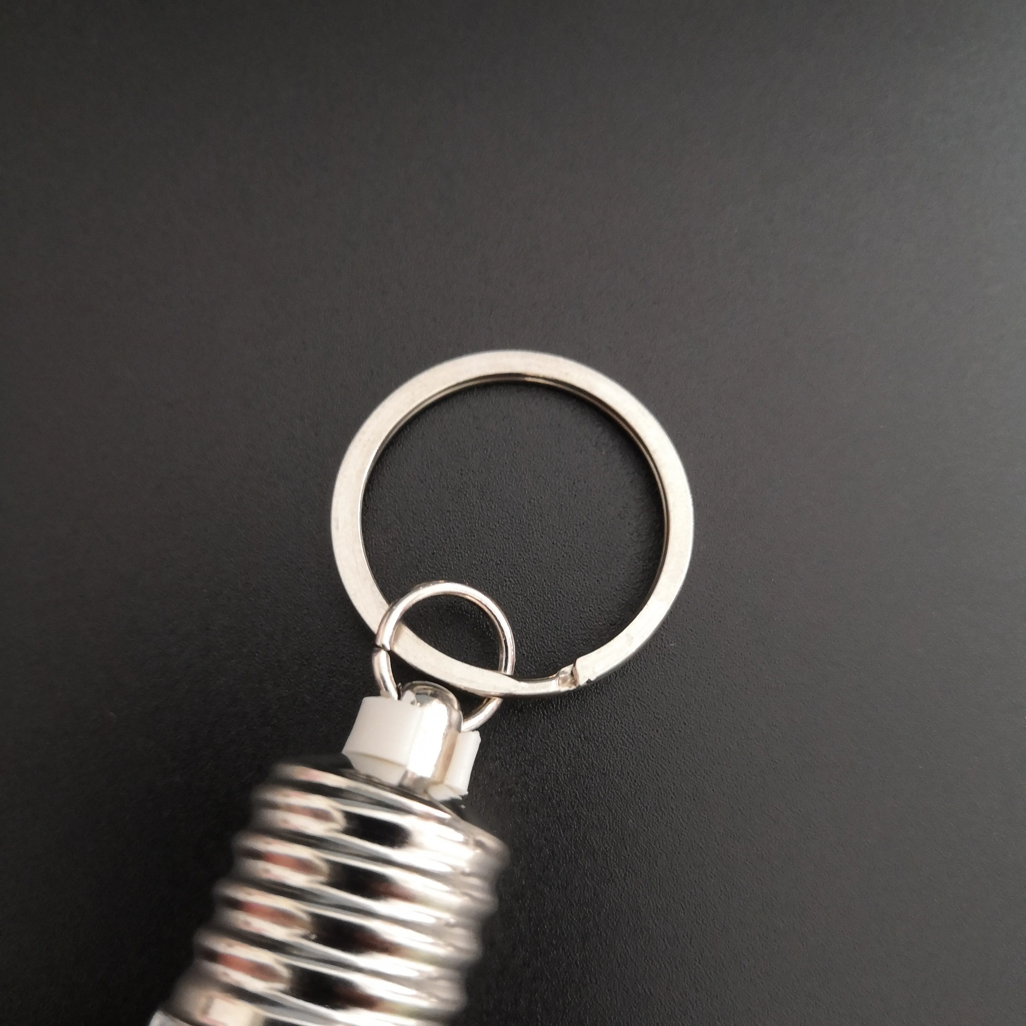 
Custom Logo Souvenir Plastic Mini Colorful Led Light Bulb Ring Keychain Cute Accesory Lovely Light Lamp Key Chain 