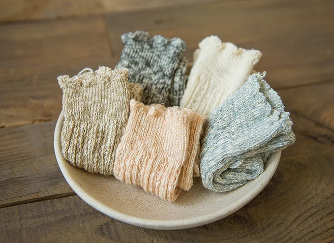 School girl knitting mid-calf lace leg warmer socks