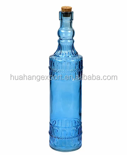 Colored patterned glass bottle with cork lid