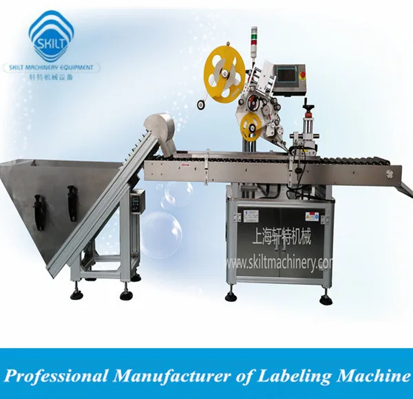 automatic sausage label applicator with feeding