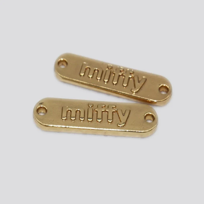 
 Металлический рельефный фирменный логотип oeko-tex 100 без никеля  