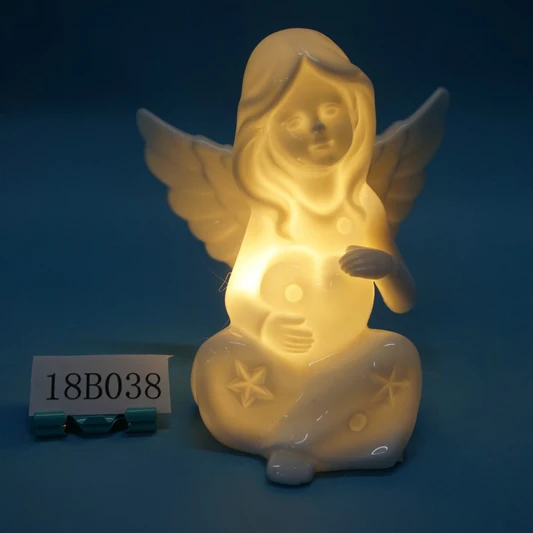 White porcelain angle figurine with light