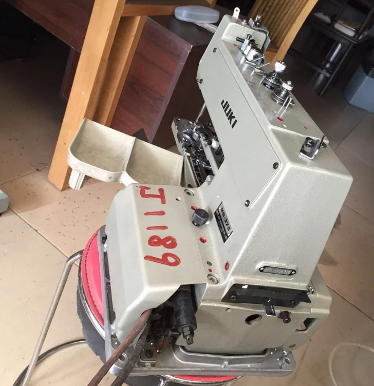 Used Juki-373 button attaching industrial machine