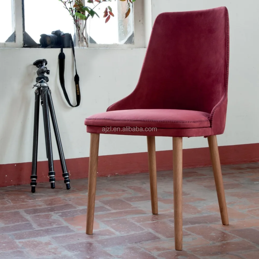 
modern chair with round backrest and wooden legs 