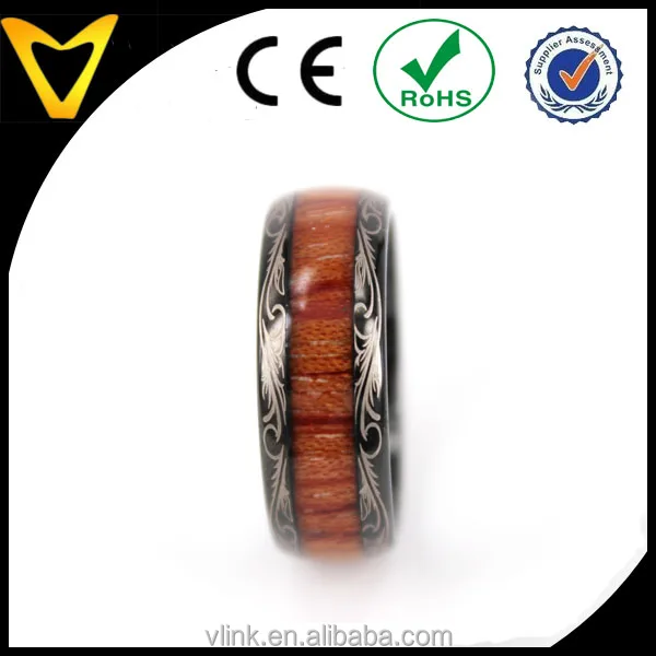 Koa wood inlay black tungsten wedding ring with floral logo lasered on edges koa wood inlay tungsten carbide ring