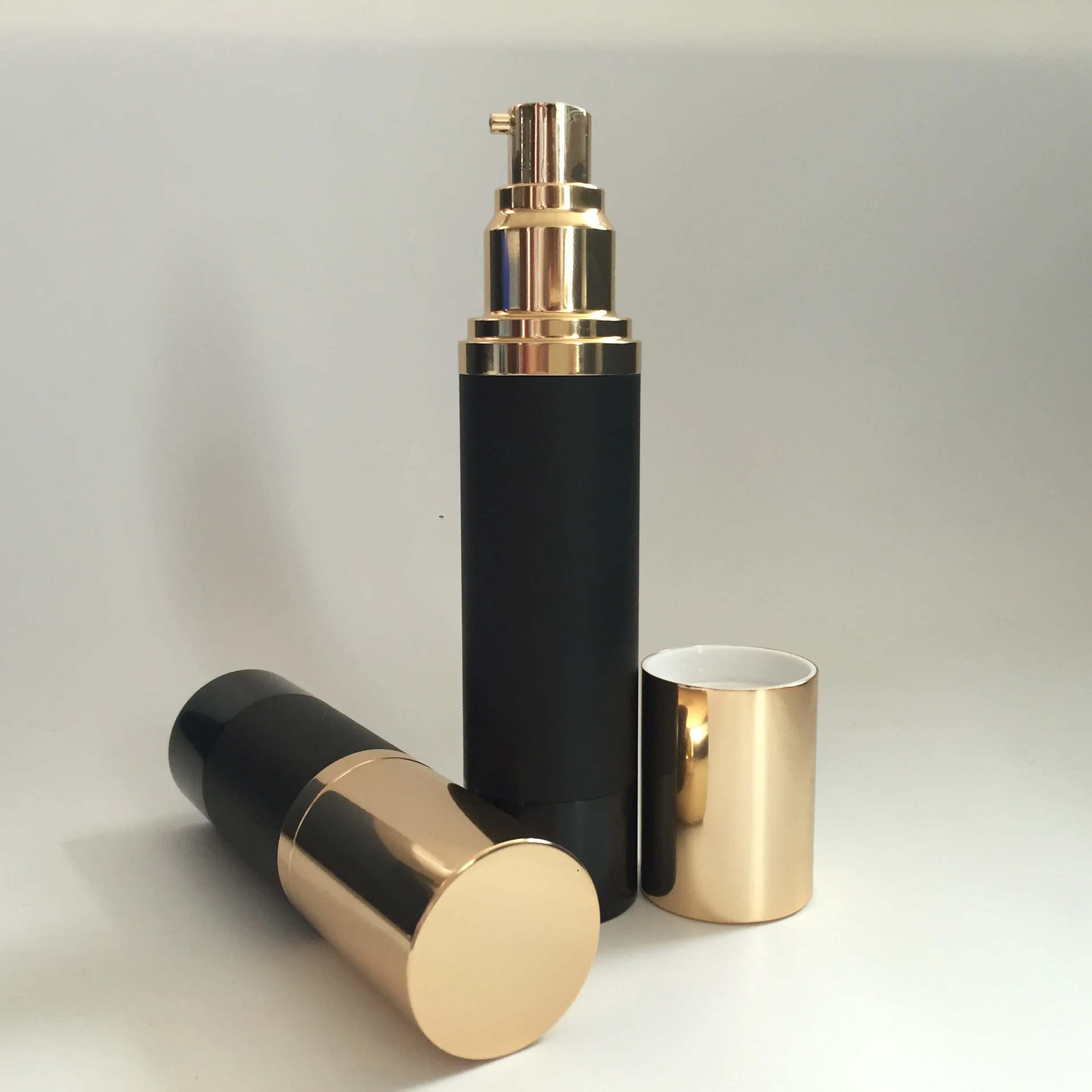 low MOQ matte black airless round aluminum bottle with golden lotion pump spray pump