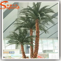 Artificial washingtonia palm tree with real bark and fake leaves
