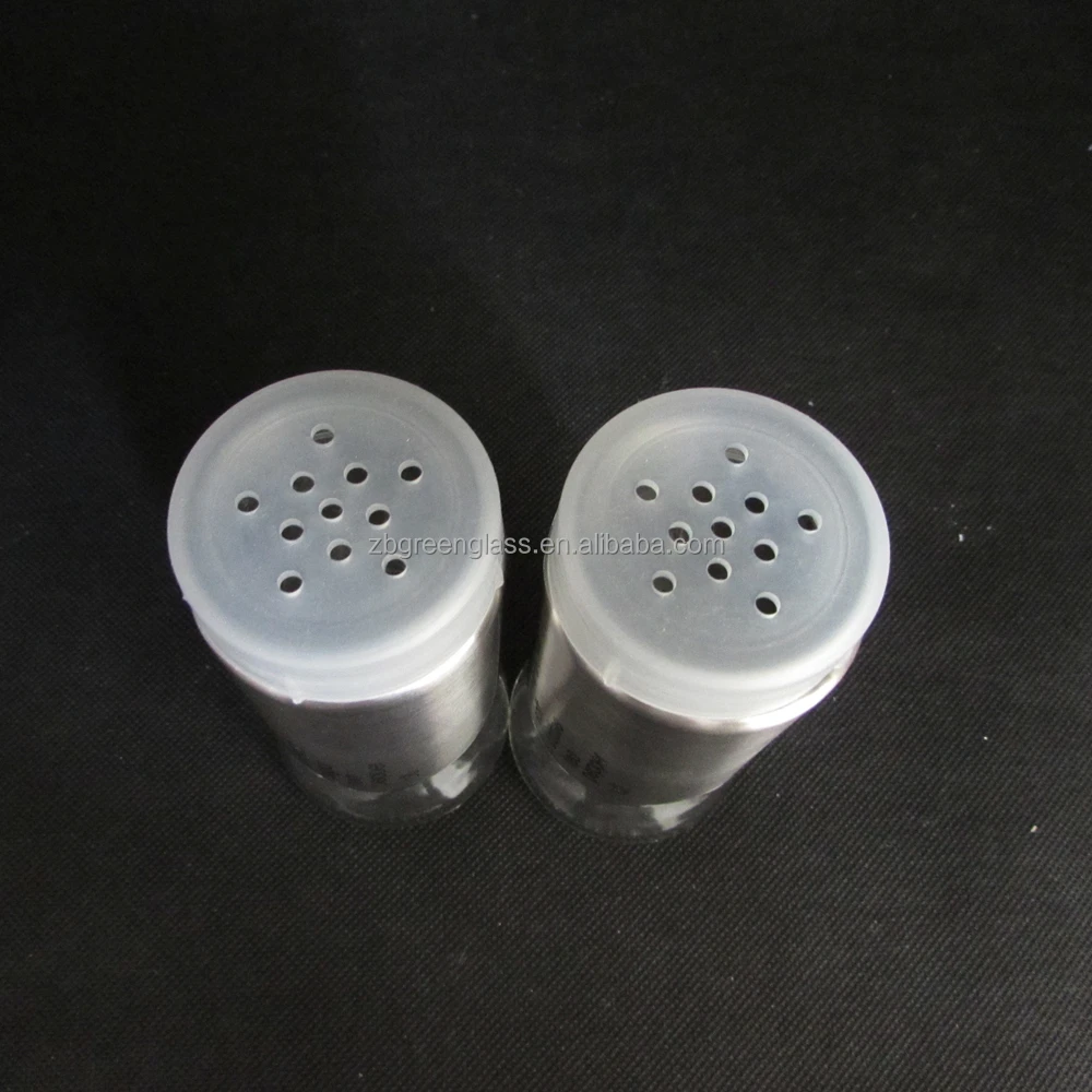 Glass salt pepper shakers and oil vinegar bottles with metal stand
