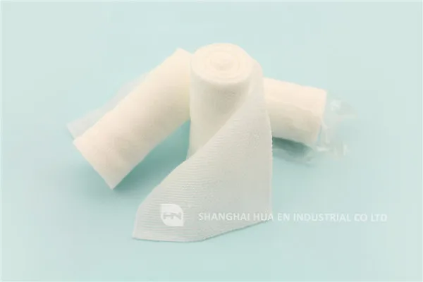 Conforming elastic cohesive stretch PBT bandage roll