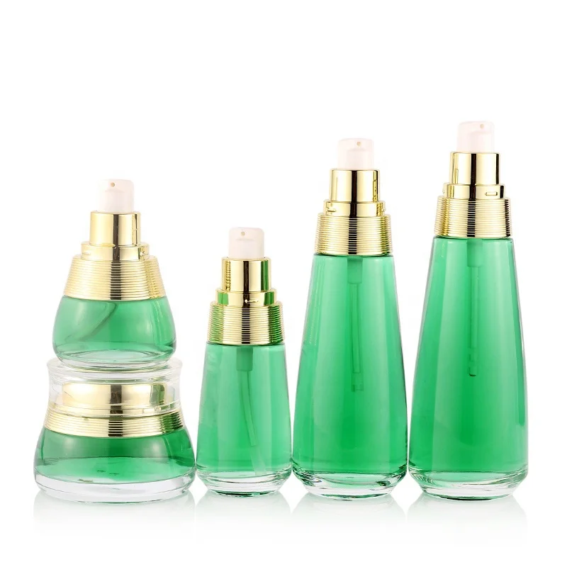 Custom cosmetic packaging transparent skin care glass bottle set with gold cap