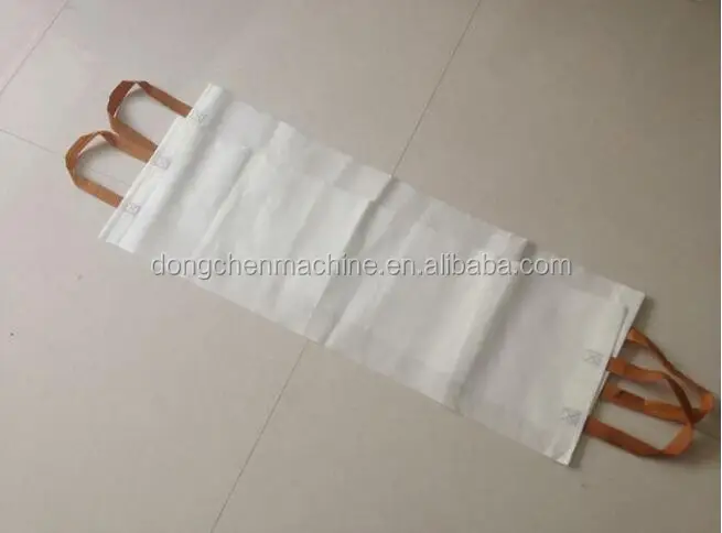 Automatic handle attaching and latitude cutting non woven bag making machine