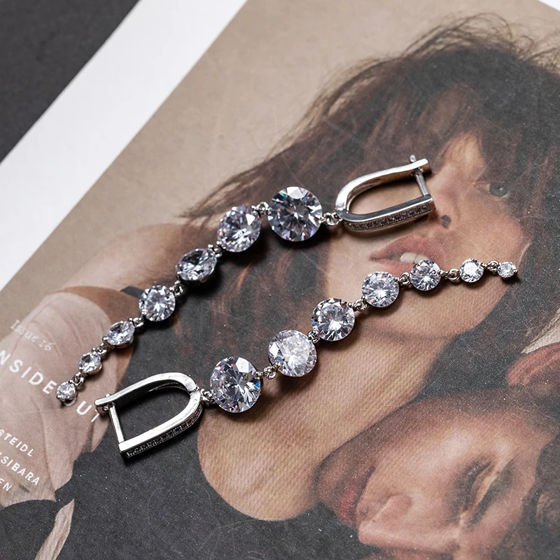 Женские длинные серьги-подвески с фианитами золотистого/серебристого цвета