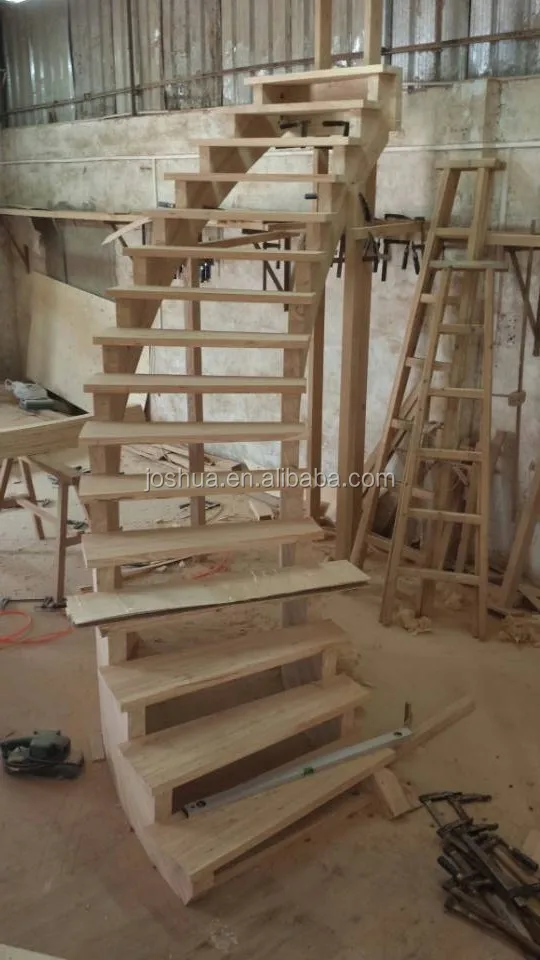 wood curved staircases with Wrought-iron balusters