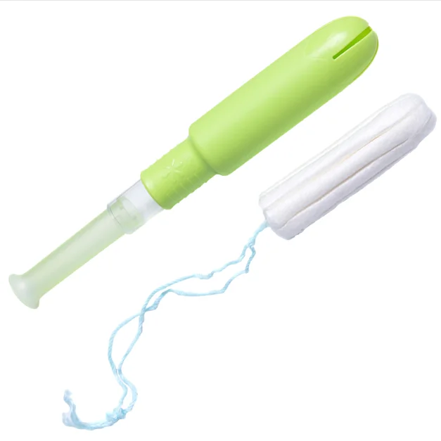 Disposable cotton tampons with plastic applicator