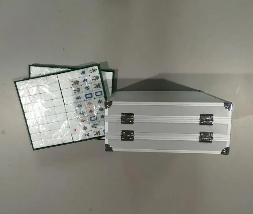 
double aluminum storage case with mahjong in it 