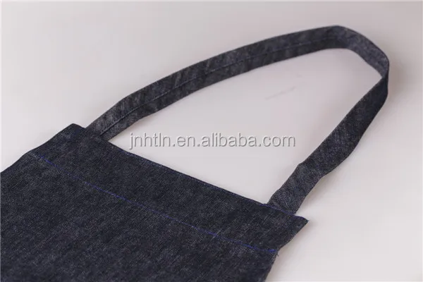 100% cotton black denim apron with printed white Logo and pockets