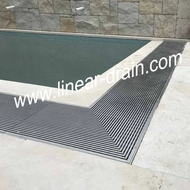 
beautiful swimming pool water draining gutter 