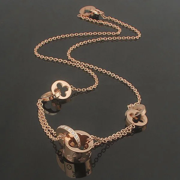 Двухместный полые титановые стали ювелирные изделия оптом Клевера картины однорядные Горный Хрусталь пару ожерелье
