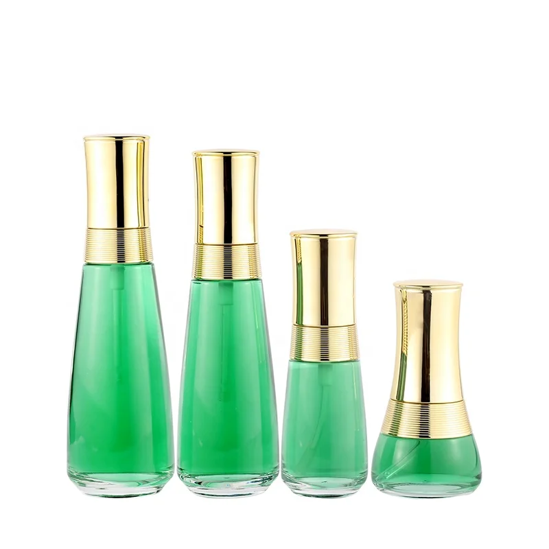 Custom cosmetic packaging transparent skin care glass bottle set with gold cap