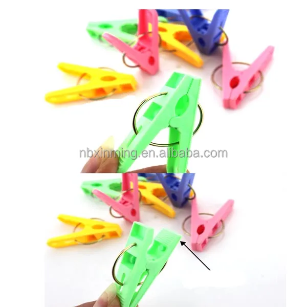 Round plastic clothes peg with hook