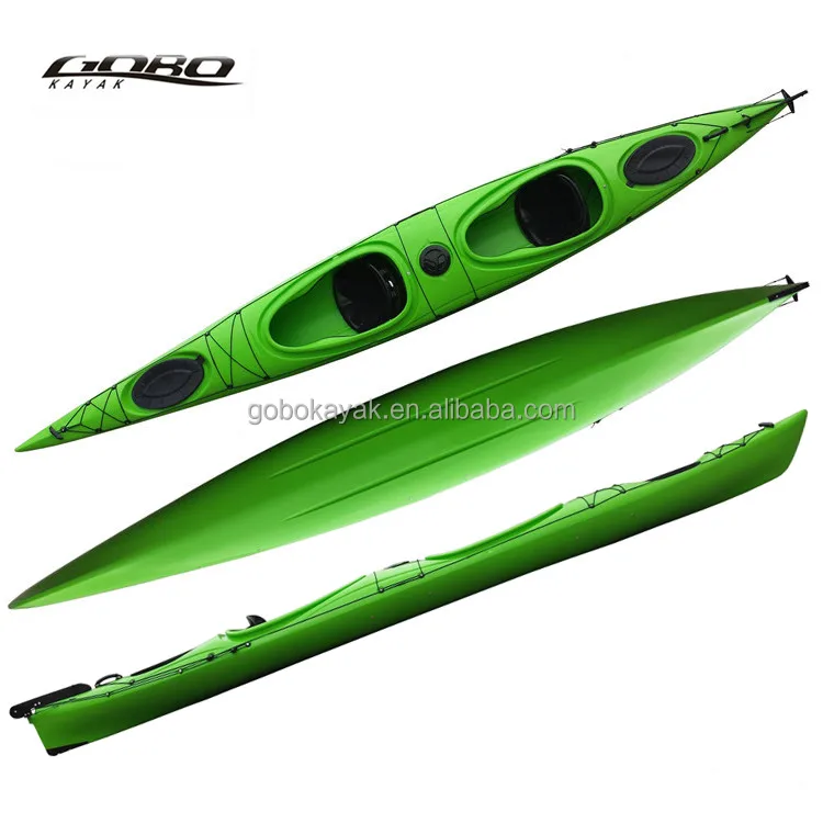 Double sit in sea kayak with pedals and paddles