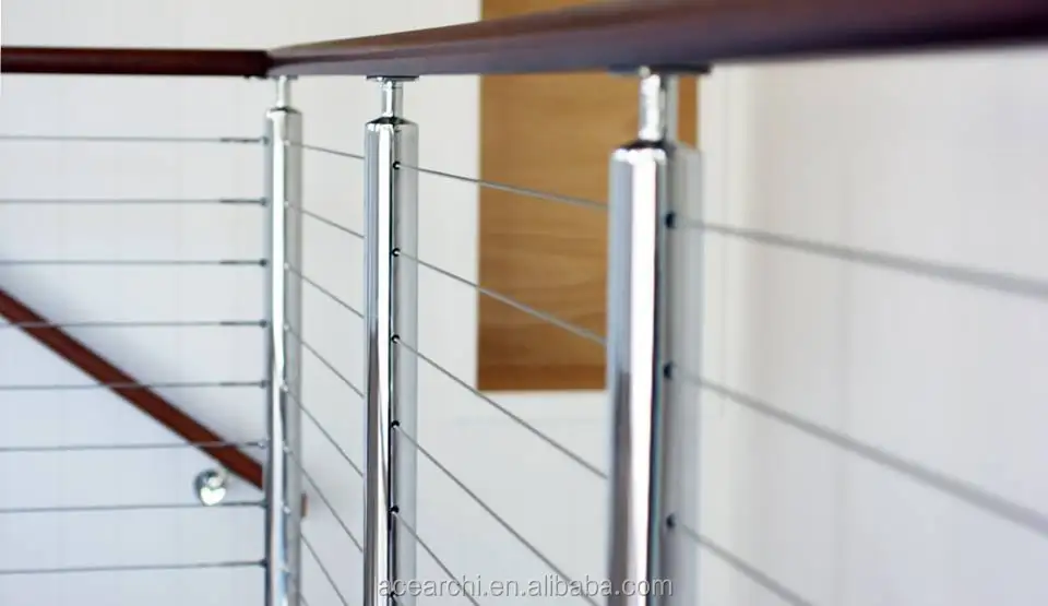 Vertical deck cable railing system with Round Stainless steel posts and Handrail