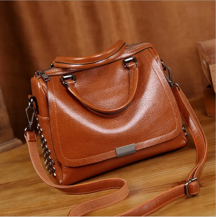 generation of handbags new European and American Boston pillow bag retro fashion handbag rivet Messenger shoulder bag