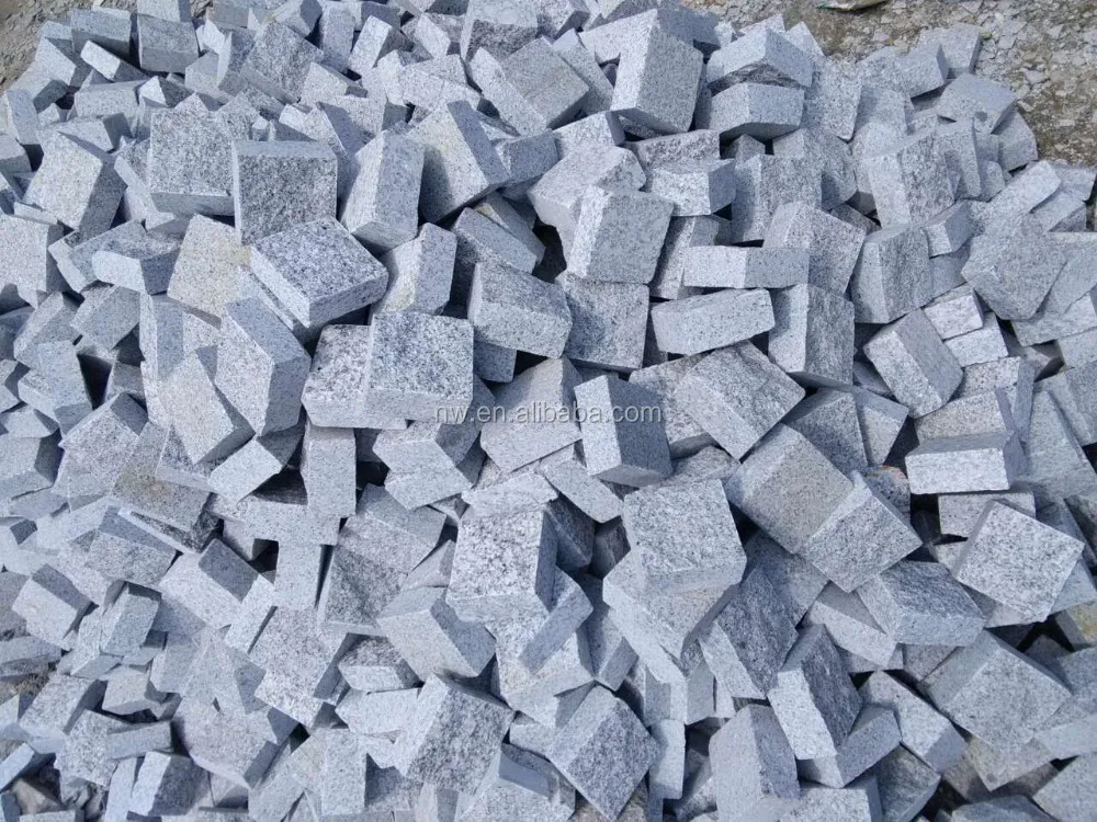 
grey granite small blocks, natural surface, paving stone 