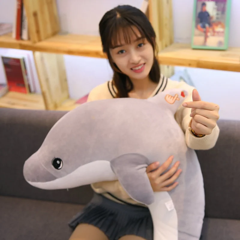 plush dolphin with hand pose logo on back baby toy