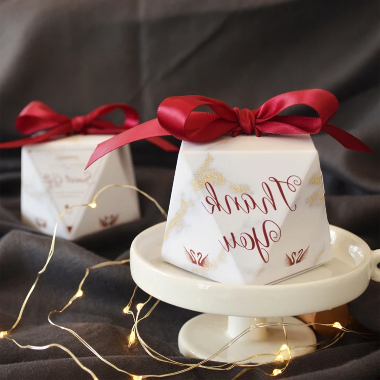 
Retail white diamond style folding candy boxes with red ribbon 