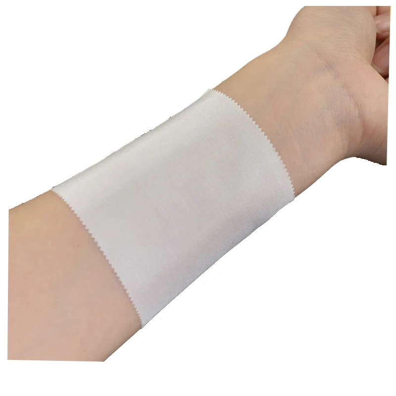 Soft and thin hypoallergenic nontoxic breathable Silk adhesive white medical surgical cloth tape for fixing gauze catheter