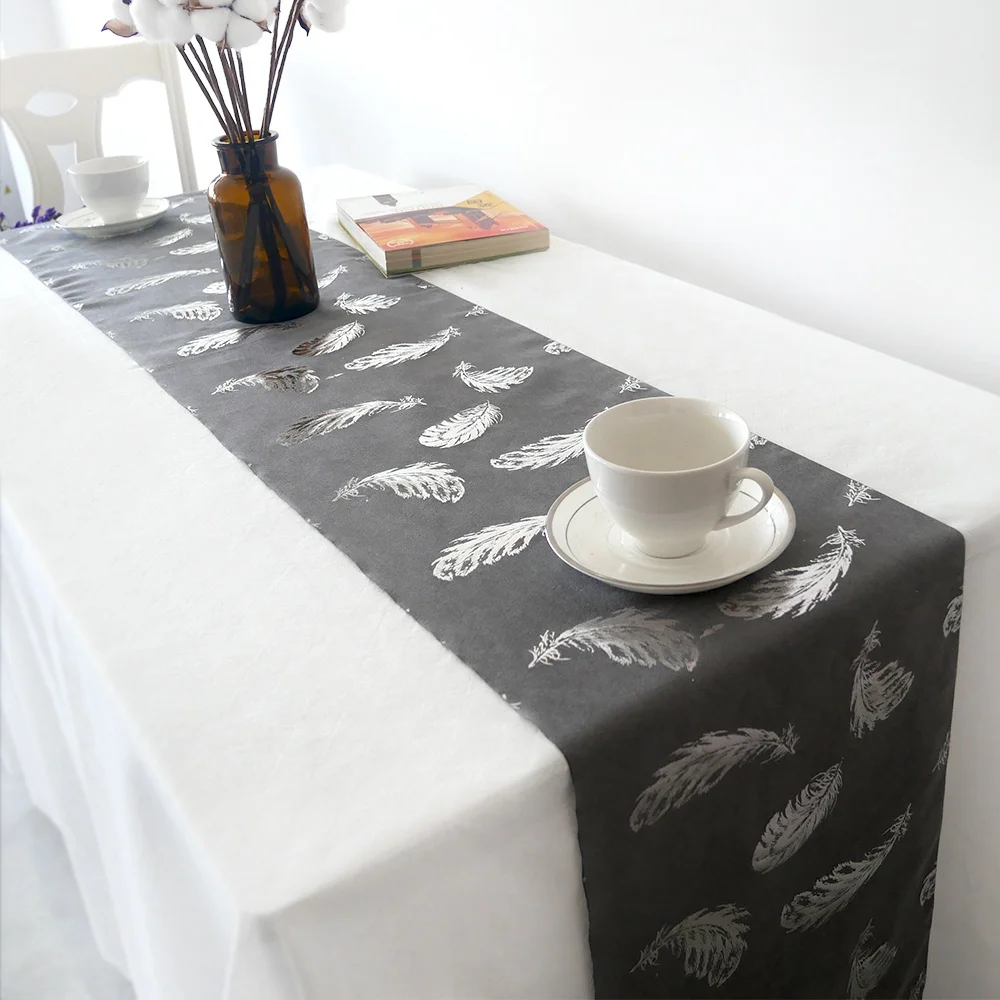 
Suede table runner,bronzed feather design 