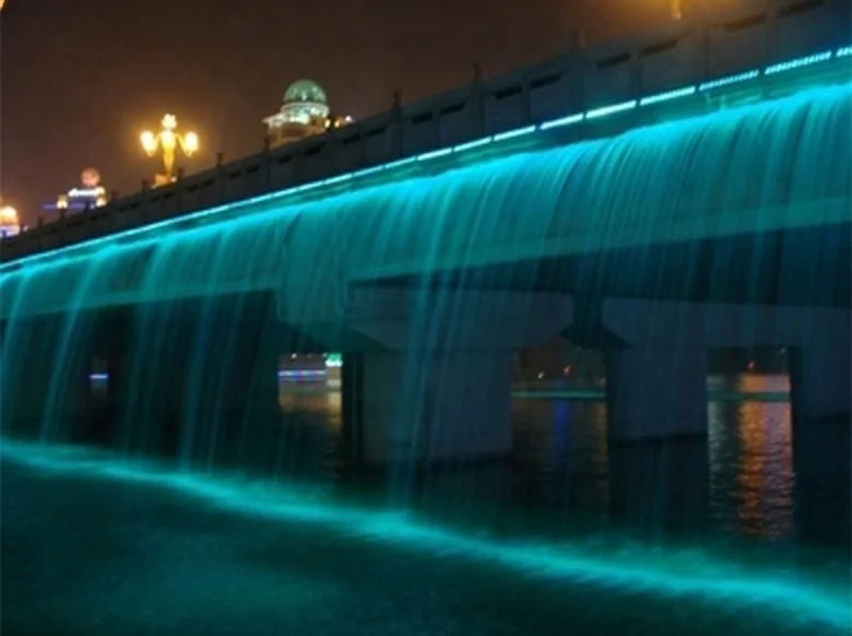 large bridge waterfall fountain colorful outdoor fountain