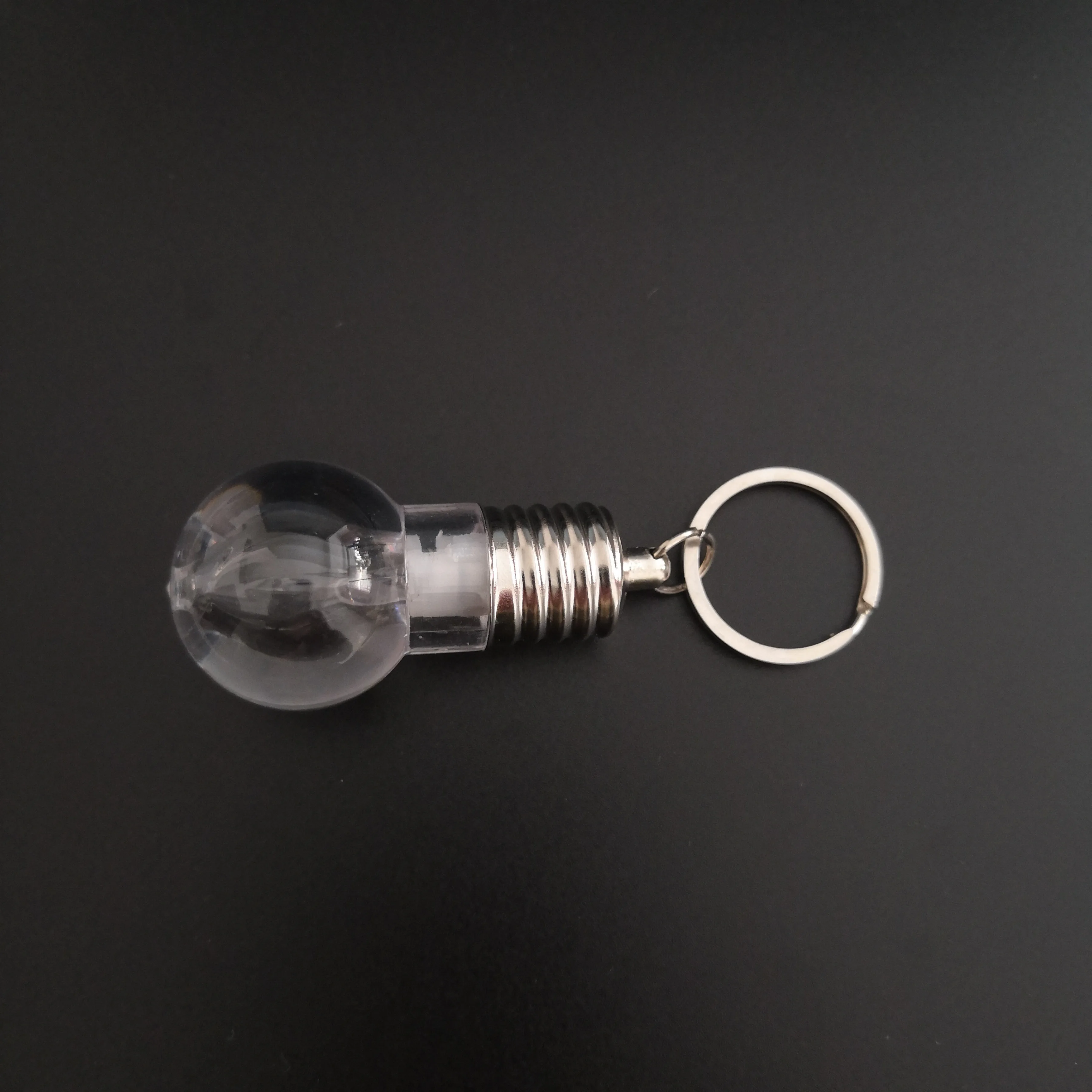 
Custom Logo Souvenir Plastic Mini Colorful Led Light Bulb Ring Keychain Cute Accesory Lovely Light Lamp Key Chain 