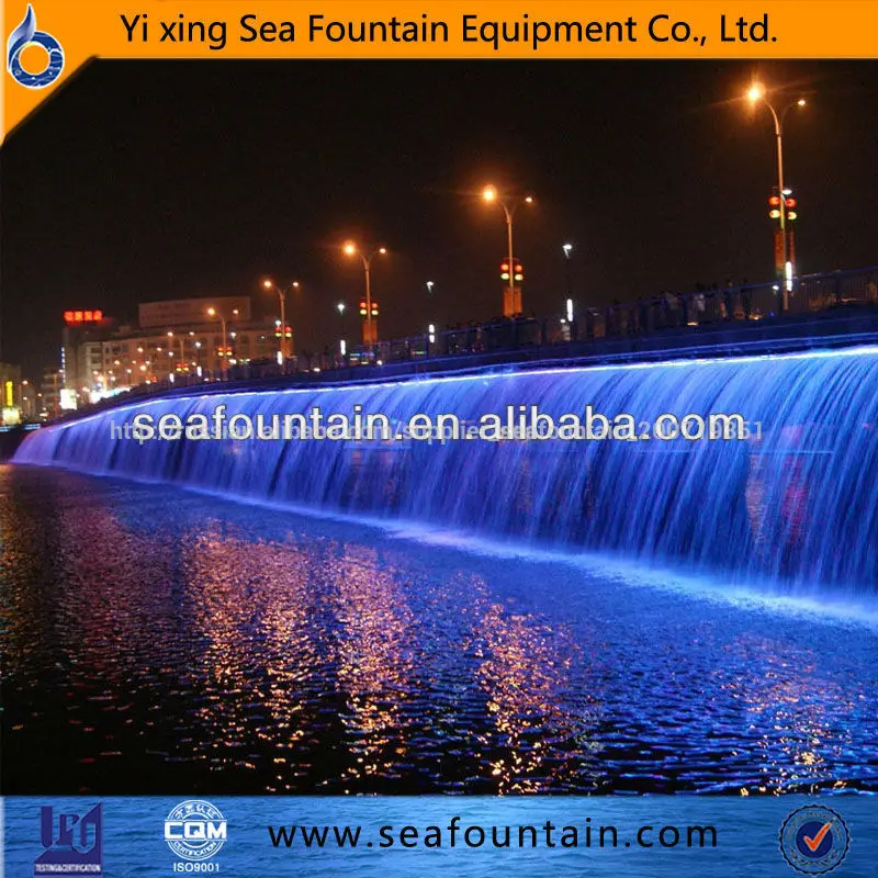 bridge or dam from waterfall multicolored multimedia musical fountain