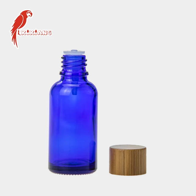 
30ml CBD Blue Glass Bottle with wooden color Childproof Tamper Cap 