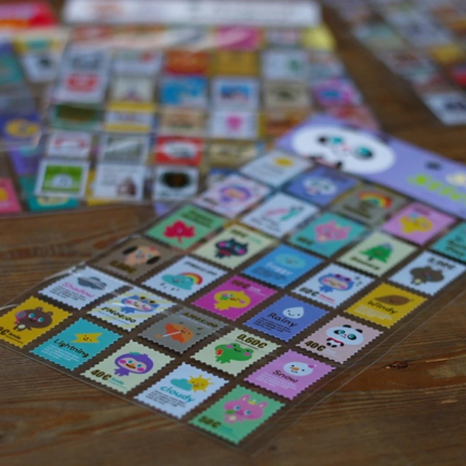 Custom design postage stamp paper stickers for kids Wholesale kiss cut art paper decorative sticker sheet