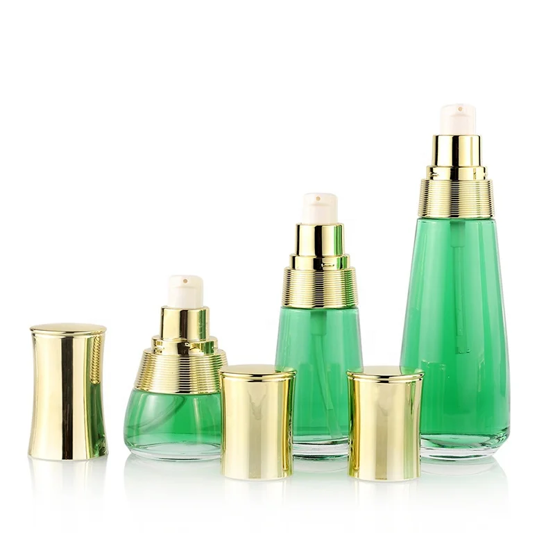 Custom cosmetic packaging transparent skin care glass bottle set with gold cap