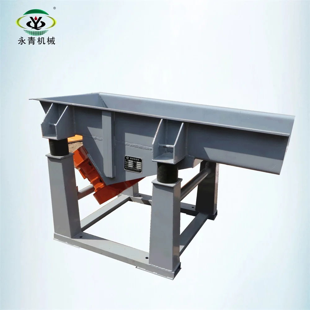 Vibrating feeder conveyor with vibration motors for grain processing