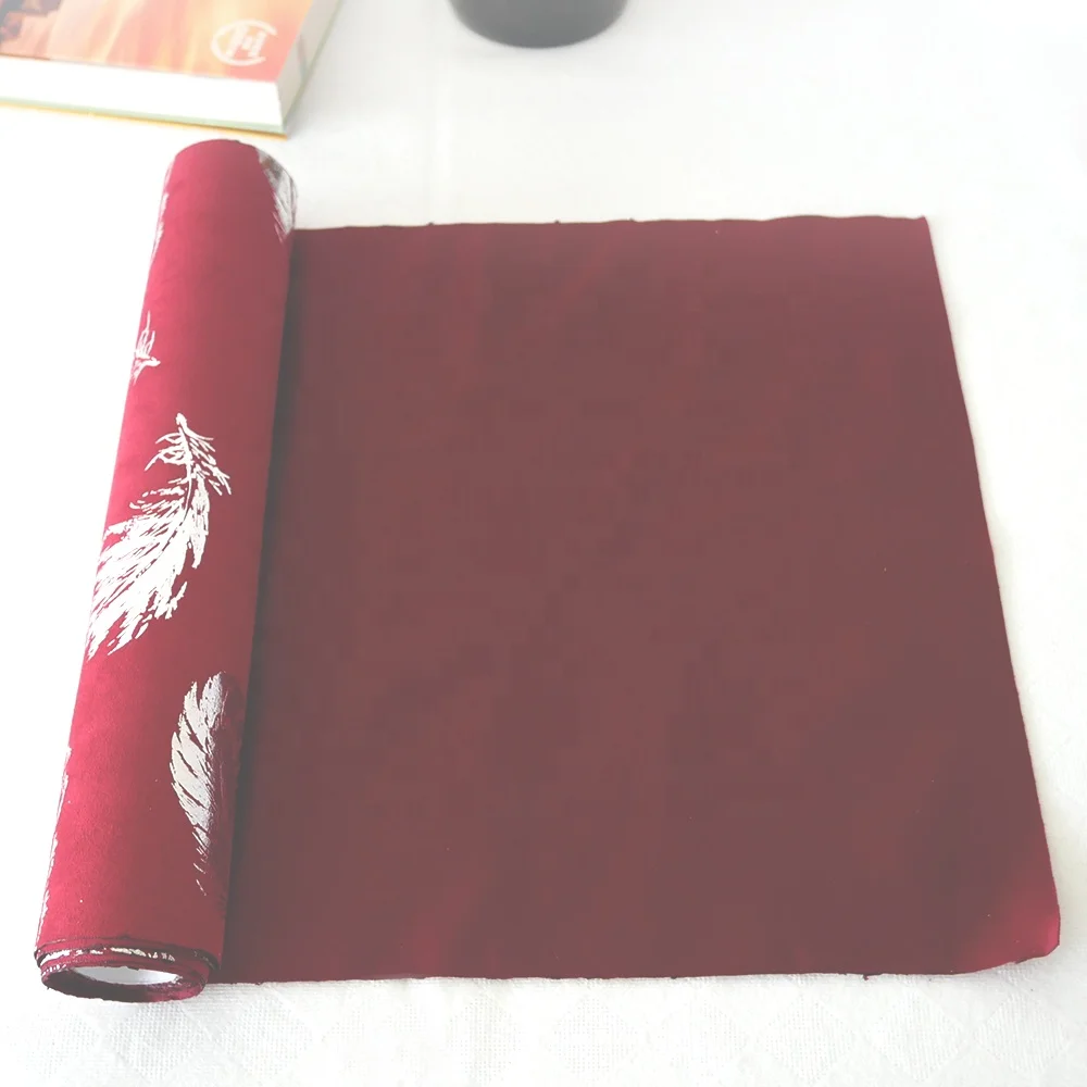 
Suede table runner,bronzed feather design 