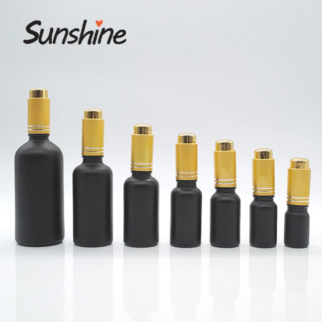 Empty cosmetic oil container 1 oz frosted black glass essential oil dropper bottle with gold pump