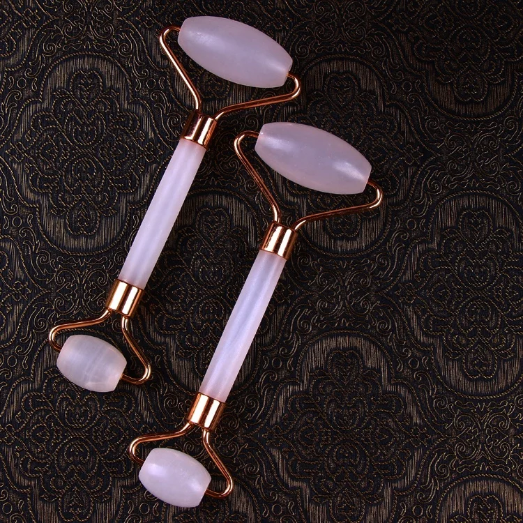 The rose quartz massage roller is used jade roller for face facial