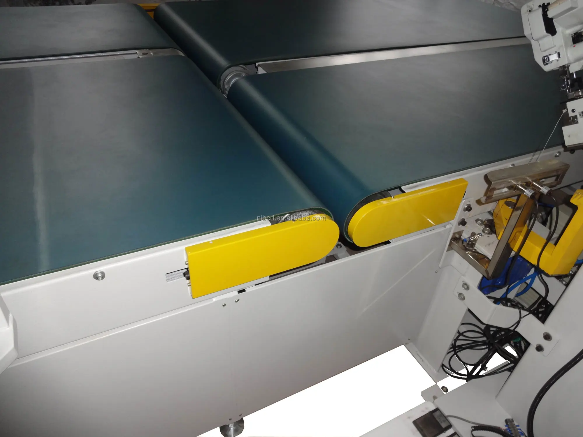 Mattress tape laying machine for mattress machine