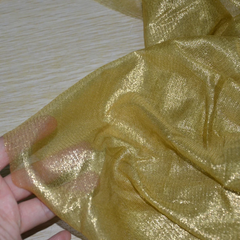 
silk gossamer golden shiny silk tulle fabric with foil 