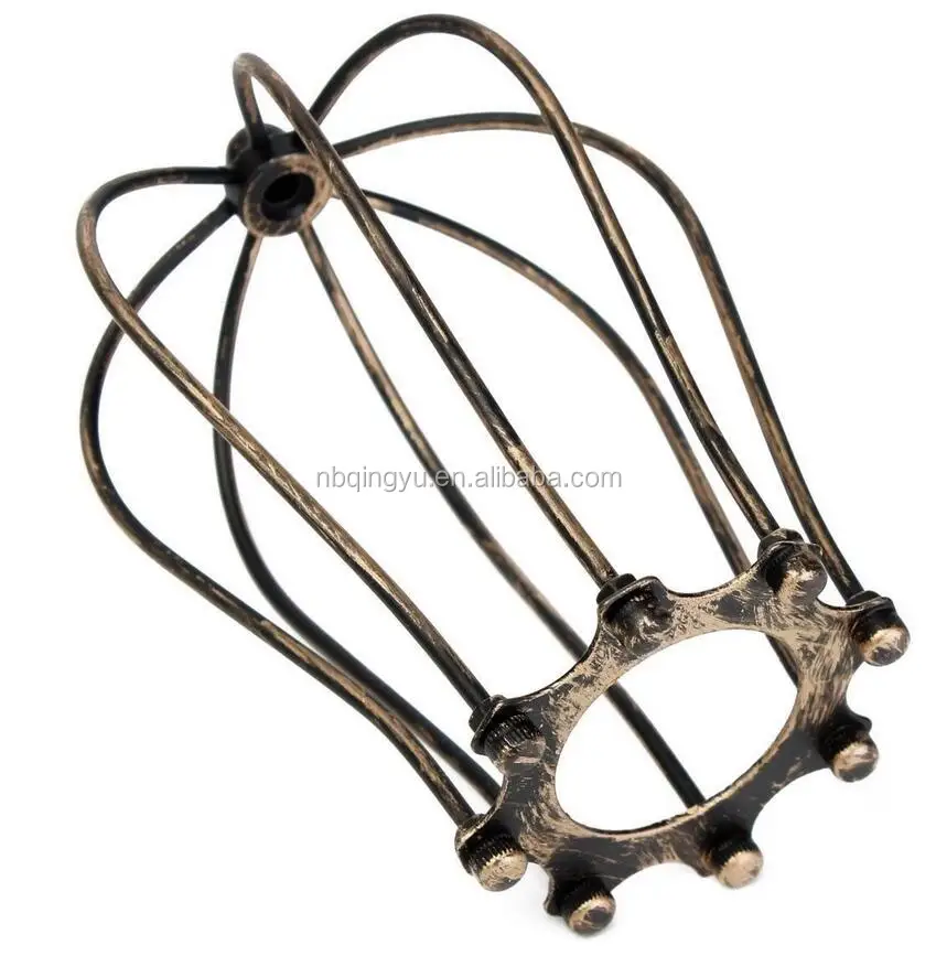 Industrial style metal cage beside lamp cast iron lampshade
