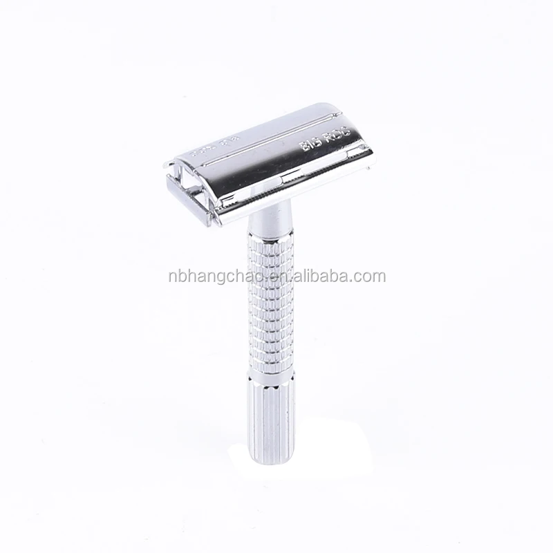 Twist to open butterfly style safety razor