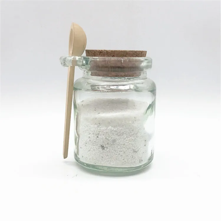 glass jar with wooden spoon   glass essential oil bottle