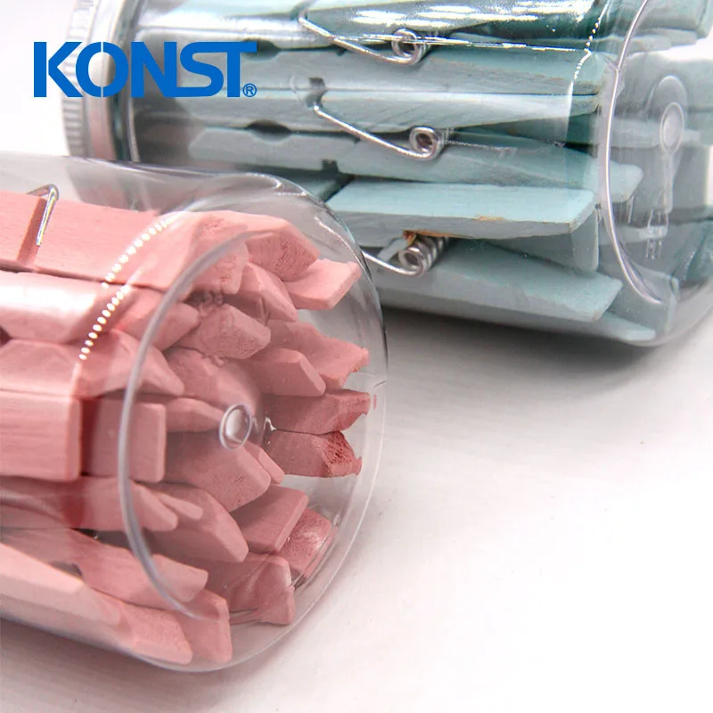 Pink wood clothes peg in plastic jar for office